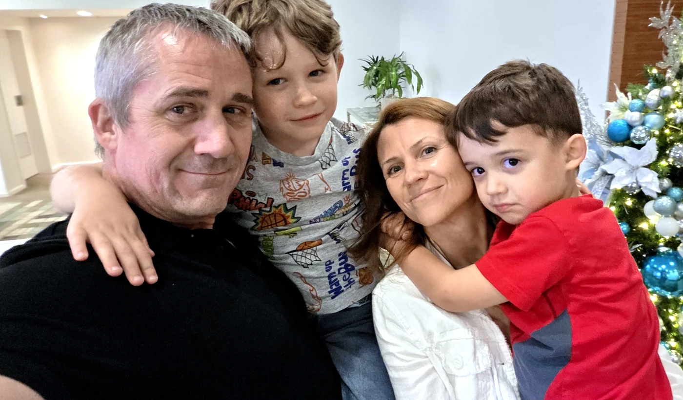 Lana and Jay with their two young sons at home.